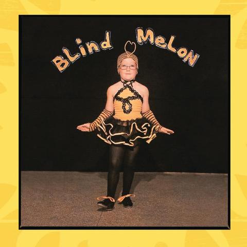Cover for Blind Melon’s eponymous album, which contains the song “No Rain”. It shows a young girl dressed in a black and yellow bee costume, as if dancing in a play or recital. The words “Blind Melon” are written in yellow, forming a gentle arch above the girl.