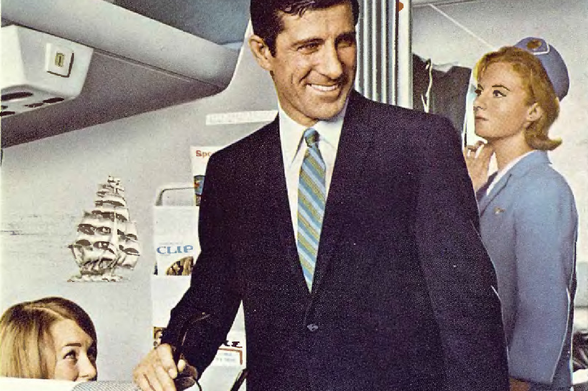 1966 A Conversation in an Airplane Cabin

The image features a man dressed in business attire, standing in the aisle of an airplane with a stewardess.
They are engaged in what appears to be a conversation.
Another individual is visible in the background, also seated in the cabin.
The man is holding a microphone and seems to be addressing an audience or conducting some sort of event or meeting within the aircraft.