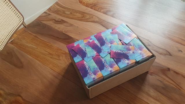 Box of 5k of the same stickers with the slogan #WeDoSTS on it.