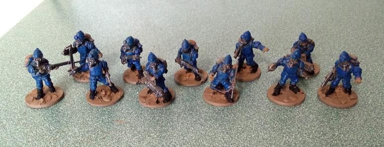 11 WGA Bulldog infantry models in progress. The squad features pith helmets, gasmasks, and weapons with additional power cables. The paint isn't finished, but these boys are in blue.