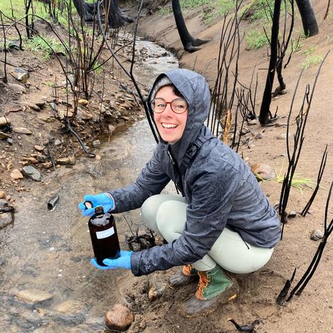 Lauren Magliozzi samples a small stream in a watershed affected by wildfire