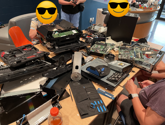 A shot later on where the table is completely covered with PCBs and various electronics all taken a part in a wonderful joyous mess.