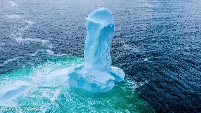 A blue phallus-shaped iceberg off the coast of Dildo, in Conception Bay.