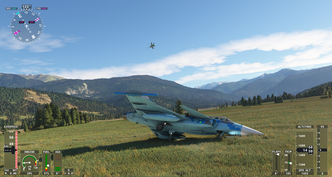 Saab Gripen in a blue livery lying on its side in a grassy field as an F/A-18 does a banked turn overhead