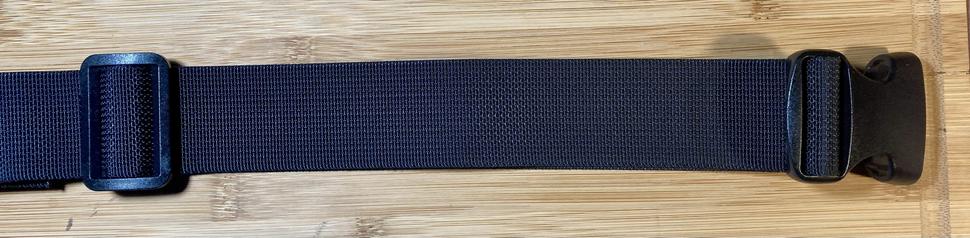 Right side section of a compound utility belt designed for concealed carry of a firearm. The belt is made from 1.5" polyester webbing and 1.5" polyester and latex rubber elastic banding, with plastic buckles. The center back section is 7" wide, constructed of four layers of elastic between two plastic tri-glide buckles, and secured in the center with a thrid tri-glide. Attached to each side is a section of webbing secured with additional tri-glides. Each side has a double layer of webbing threaded through the main buckle half, and secured to the center back section with a tri-glide buckle. The double layer provides additional stiffness for a holster wing.