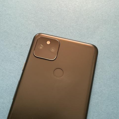 The back of my Pixel 5a, showing the crack in the glass cover of its camera assembly.