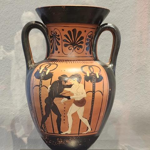 Greek vase painting black figured man but female in white. Peleus wrestling with Atalante
