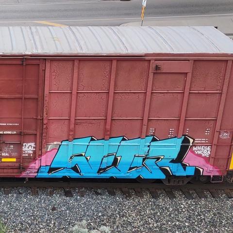 Train car with graffiti rolling through Kamloops BC Canada