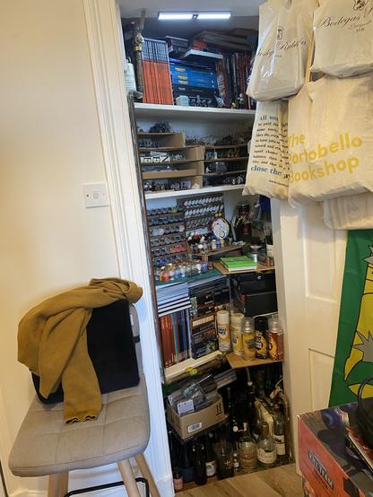 Edinburgh Press with a light, Warhammer Books, miniatures, and paints.