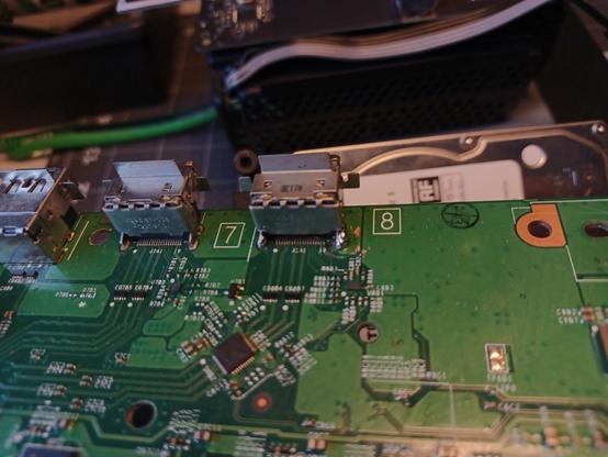 the "top" side of the motherboard, focused on the large solder blobs I had to make sure went through the holes from the bottom so the port legs would be held solidly in place