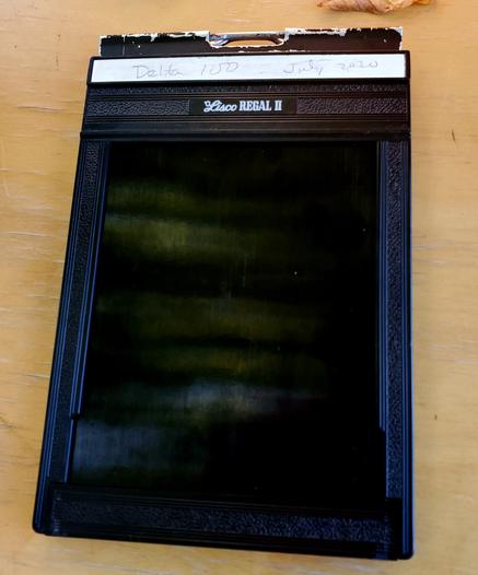 An analogue 4x5 film casing. Marked Delta 100 July 2020.
Lisco Regal II