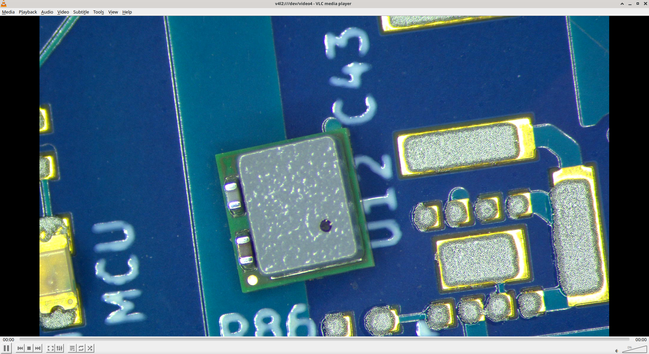 DC-DC module with a gold dot in one corner and a black ink dot in another corner