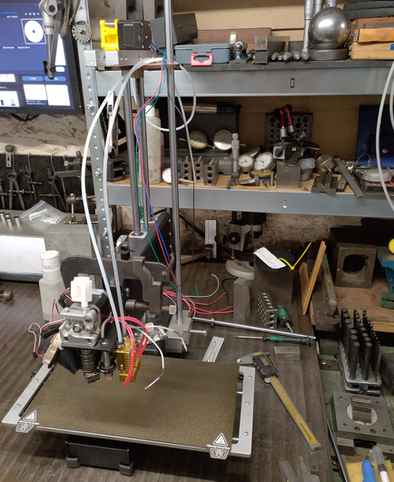 2015 Printrbot Simple Metal 3d printer undergoing mods on a workbench.