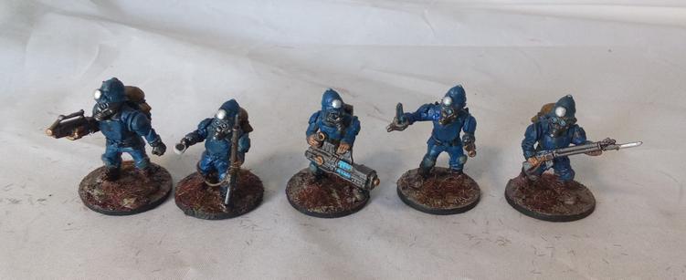 Five scifi soldiers done up like british bobbies.