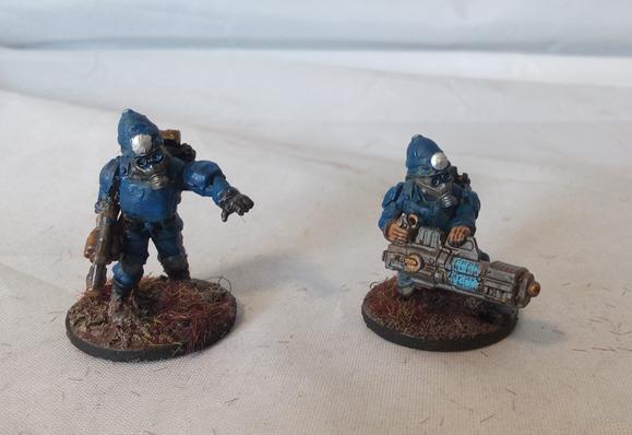 Close-up on two soldiers, the left has a grenade launcher, the right has a plasma gun.