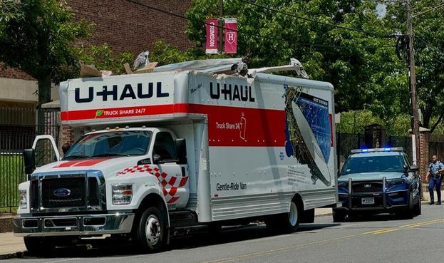 U-Haul truck with roof freshly peeled back, by Paul Kafasis