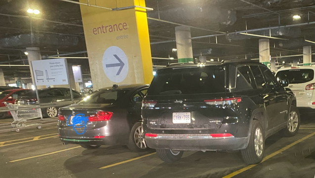 Car parked over the line in underground parking lot