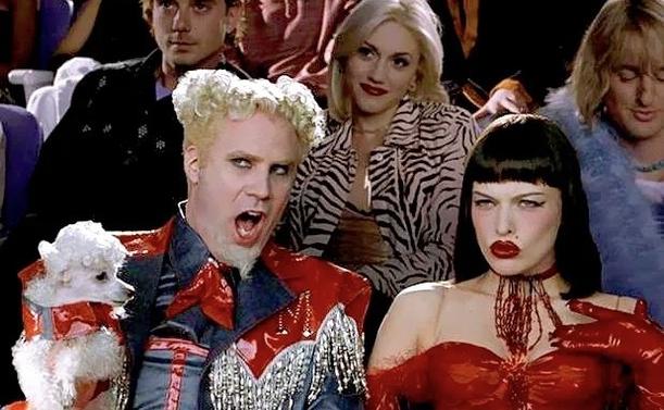 still from the 2001 film Zoolander: Will Ferrell as Jacobim Mugatu and Milla Jovovich as Katinka Ingabogovinana sitting in a movie theater