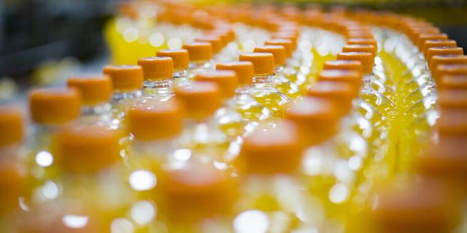 Tops of citrus sodas at a manufacturing plant.