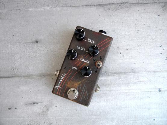 a brown pedal effect with four knobs