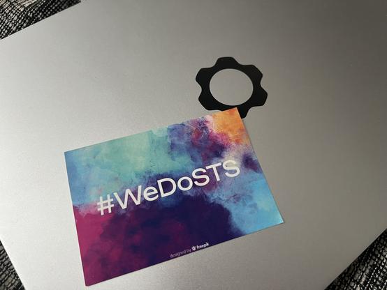 A colorful sticker reading #WeDoSTS