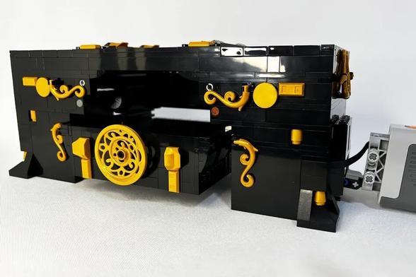 A model of a card shuffler made of Lego bricks