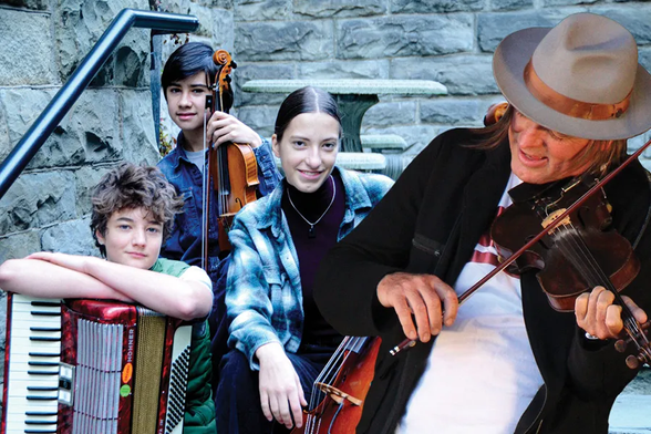 An adult fiddler in a hat plays a hot lick while three musical youth behind him, bearing fiddle, cello and accordion, rest before aged masonry.