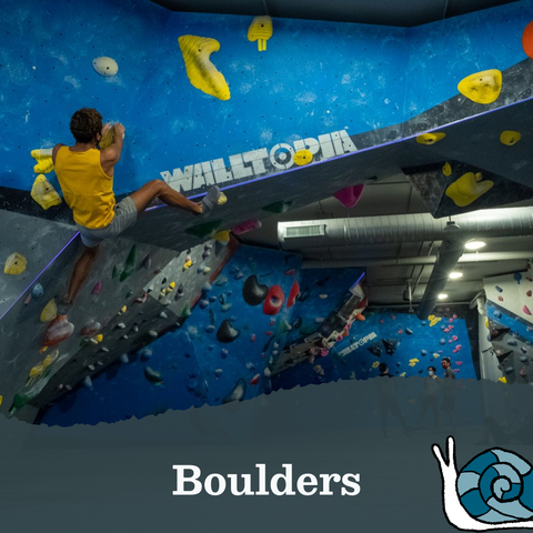 Text that reads Boulders, next to a blue snail illustration. The text is layered on an image of a man climbing an inverted rock wall indoors.
