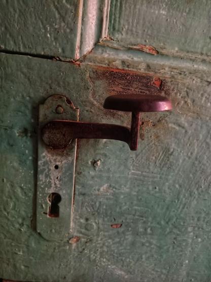 very old door handle, light green door