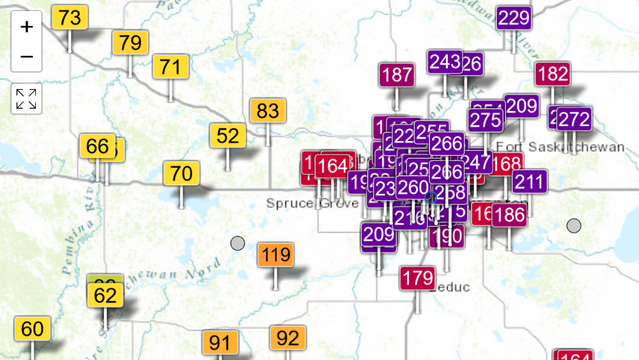 Map from aqicn.org or the greater Edmonton area with flags indicating air quality readings (numbers on the US EPA scale). Edmonton itself is smothered with red unhealthy and purple very unhealthy flags, up to AQI 266. 100km west of the city, however, the air is still in the yellow moderate zone, AQI 66 in the village of Entwhistle.