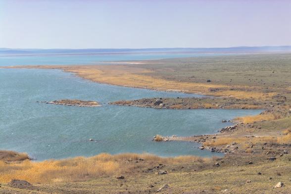 A large blue lake in the Kazakh steppe