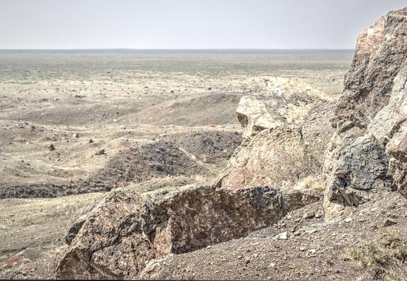 A view across the Kazakh steppe from the rocks, rubble and mounds of earth uprooted by a huge nuclear explosion in 1965