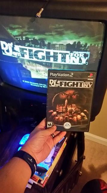 Ps2 Game Case of Def Jam Fight for New York held in front of a CRT TV displaying the title sceeen