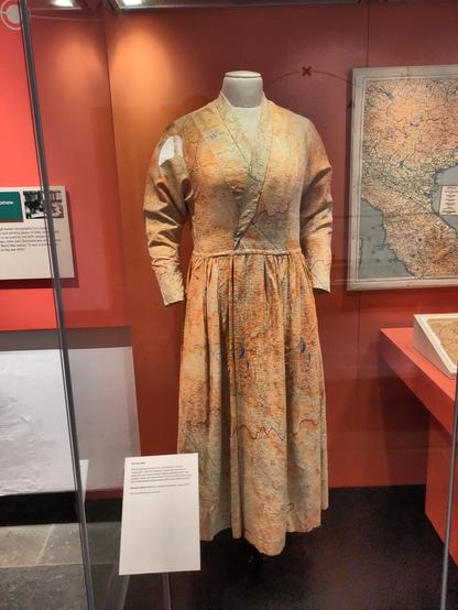 World War 2 "escape and evasion maps" upcycled as a dress at a time where fabric was rationed.
