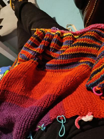 Striped fabric made using Tunisian crochet knit stitch. Fabric piece pictured will be used for the hood of a cardigan