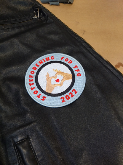 The sticker covering the tear
