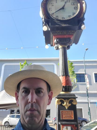 Photograph of the author, Michael Dunn, in front of the Alibi Clock, now in Vallejo, California, near the Alibi Bookstore