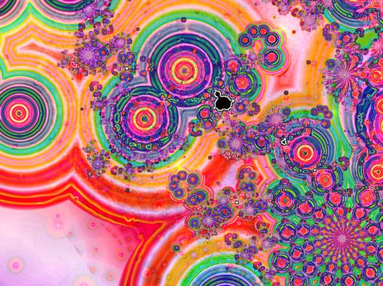 Fractal shapes with rippling rings of yellow, orange, red and green