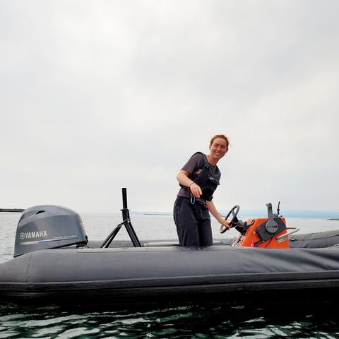 Our awesome young, red headed support & Zodiac safety boat gal. On the ocean.