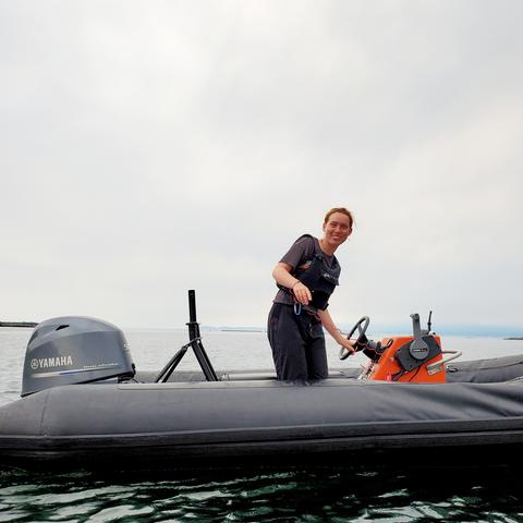 Our awesome young, red headed support & Zodiac safety boat gal. On the ocean.