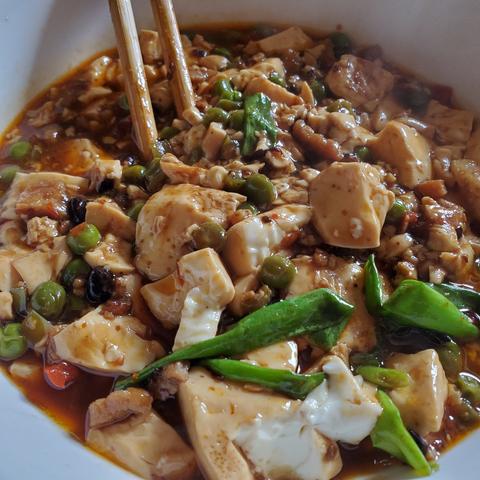 Bowl of soft tofu with mixed vegetables.