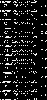 A screenshot of the black background with white text of a terminal window. The text shows several files being transferred at a rate of about 136 megabytes per second.