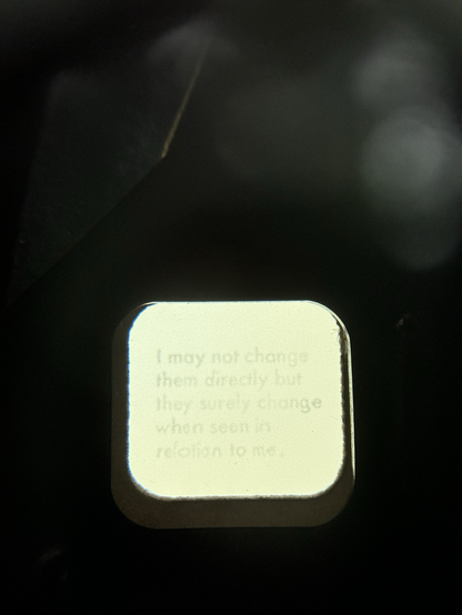 View inside the one side of a View Master showing the phase I may not change them directly but they surely change when seen in relation to me” in foggy text.