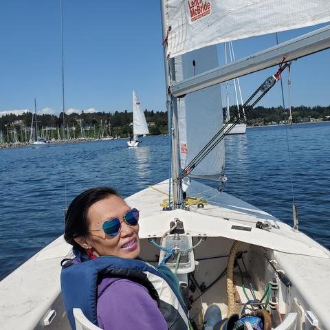 Me in Martin 16 sailboat front seat. In Oak Bay harbour waters.