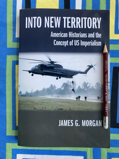 Morgan’s monograph Into New Territory: American Historians and the Concept of Imperialism (2014) on a geometric patterned cloth with pencil