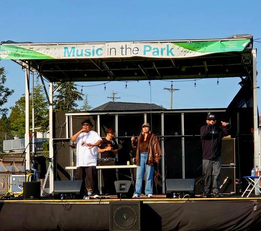 Paint It Red Indigenous hip hop group performing on stage.