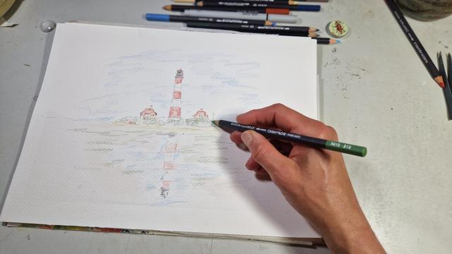 Skizziere mit aquarellstift auf einem Malblock den Leuchtturm Westerhever