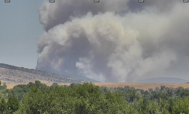 Large billowing smoke in the foothills around Loveland