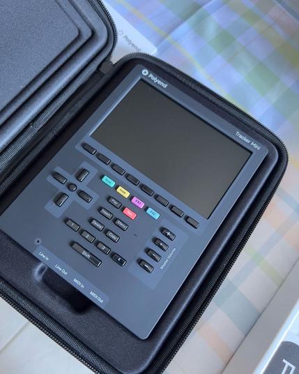 A photo of the Polyend Tracker Mini, a small handheld music-making device that you can bring anywhere!