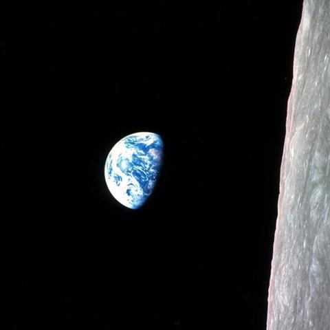 "Earthrise" photo taken by William Anders on December 24, 1968 while the crew of Apollo 8 mission viewed the earth as their vehicle traveled around the moon. They went around the moon four times and made a nearly perfect circle around the moon on a subsequent pass.